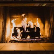 Avoid Chimney Cleaning Logs, logs burning in indoor fireplace