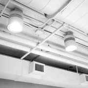 Clean air ducts in a well-lit and clean building hallway