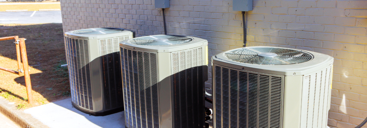 An outdoor air conditioning units has been installed on exterior facade of new house