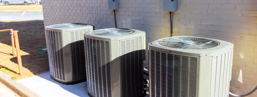 An outdoor air conditioning units has been installed on exterior facade of new house