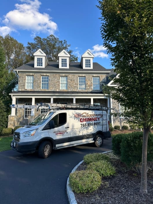 Sixpenny Chimney Sweeps' Certified Chimney Sweep Service Van in front of home in Mclean, VA