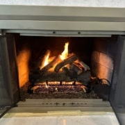 Gas log installation with realistic vented gas logs in Montclair VA fireplace