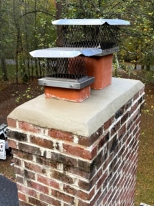 chimney-leak-repair-new-chimney-caps-crown-repair-northern-virginia Chimney leak repair featuring new chimney caps and chimney crown repair on a masonry chimney in Northern Virginia by Sixpenny Chimney Sweeps